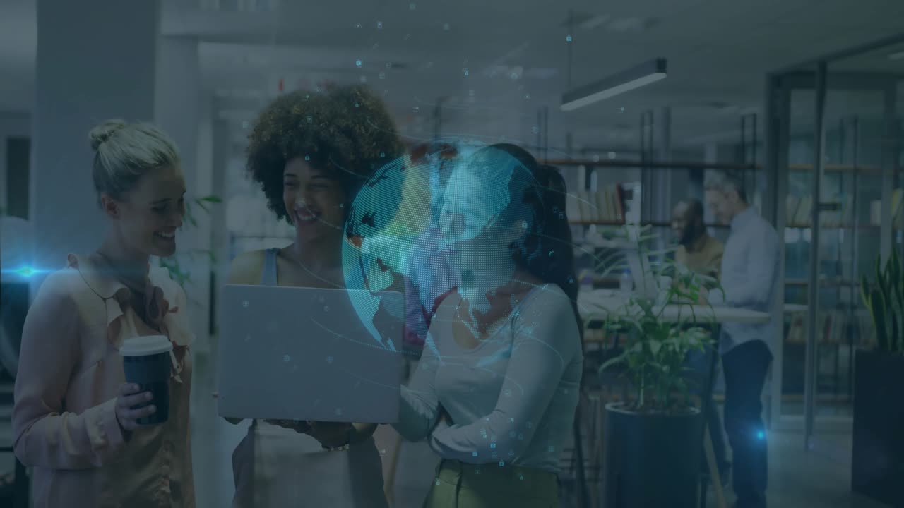Three women raising laptop in office activating rotating holographic globe showing global data