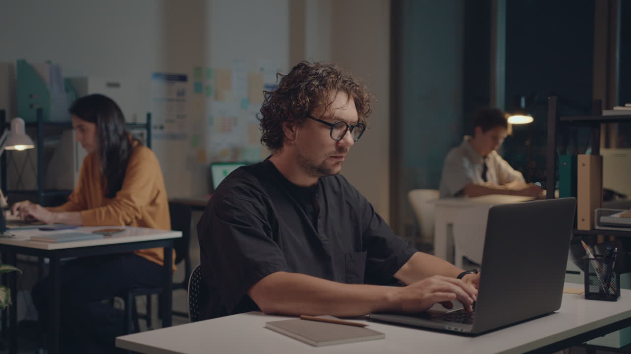 Young Businessman Working on Laptop in the Office during Night