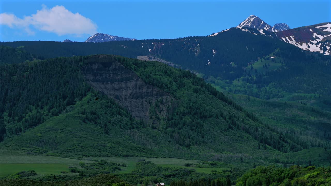 Flying bird Capitol Peak 14er Wilderness spring summer aerial drone parallax Colorado Aspen Snowmass Elk Rocky Mountains Range Capitol Creek rd trail Aspen grove White River Forest snow fields follow
