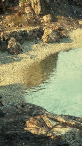beautiful beach with clear blue water and rocks