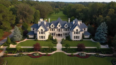 grand luxury mansion with extensive gardens and golf course view