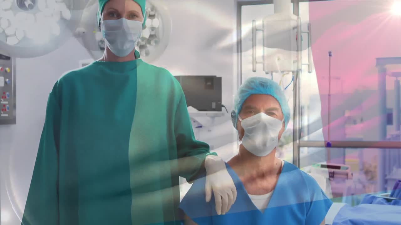 animación de la bandera de francia ondeando sobre los cirujanos en el quirófano