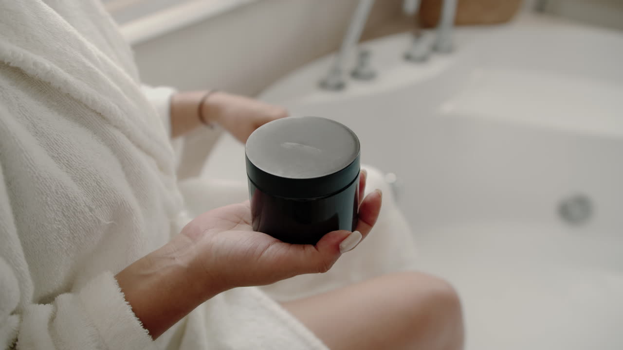 Hands of Woman Opening Coffee Scrub before Applying on Body