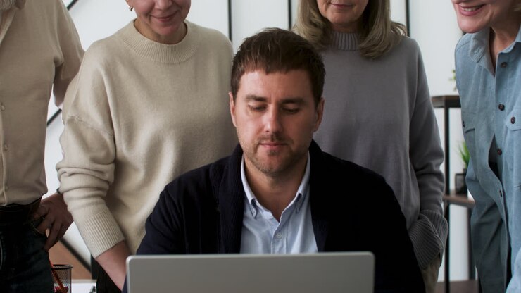 Male teacher and students in classroom