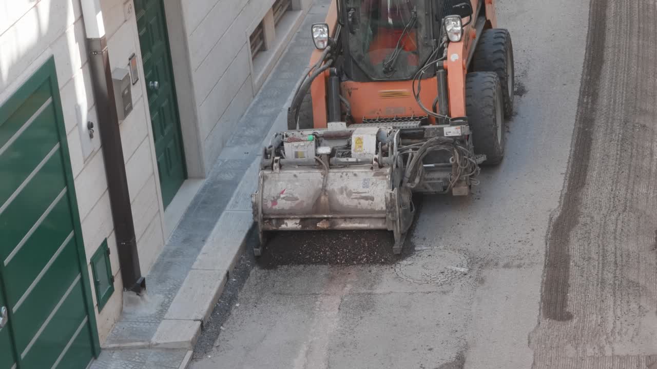 Milling of asphalt for road reconstruction accessory for skid steer
