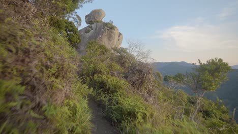 moving image of vegetation and rocky formations atop mountains at sunrise, peito do pombo, arraial do sana, rio de janeiro, macaé, brazil