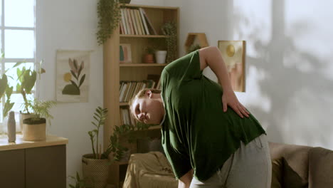 young guy exercising at home