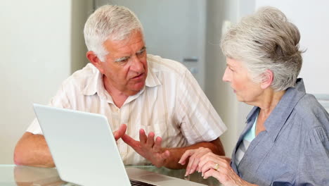 Senior-couple-using-laptop-together