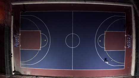 aerial view of a multi-use sports court at night