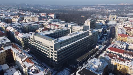 national gallery building in prague, czech republic, aerial drone view, traffic on street, winter day