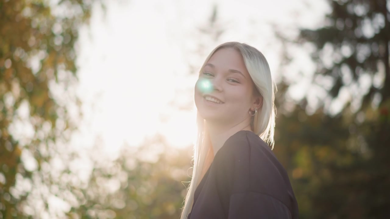 Young Blonde Woman Posing Outdoors at Sunset