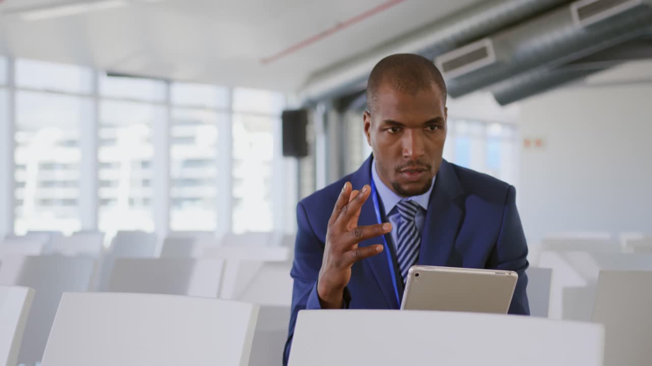 Male speaker practicing his speech at a business conference