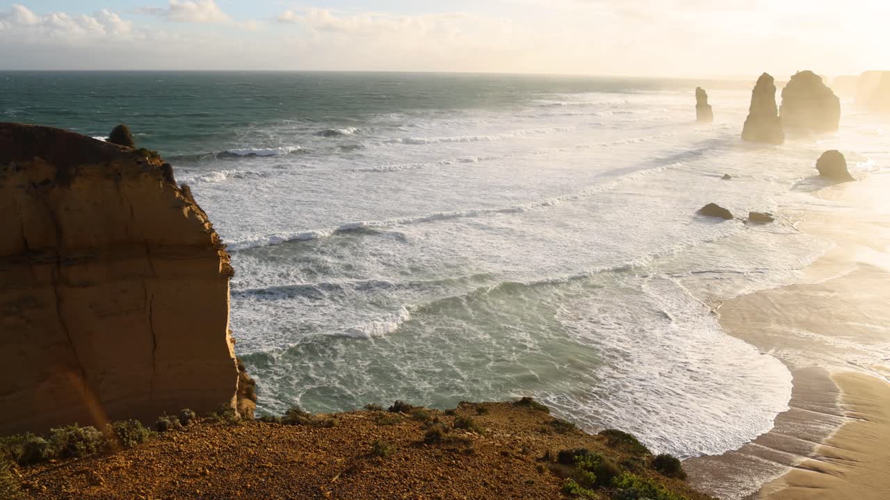 Waves crashing against iconic limestone stacks