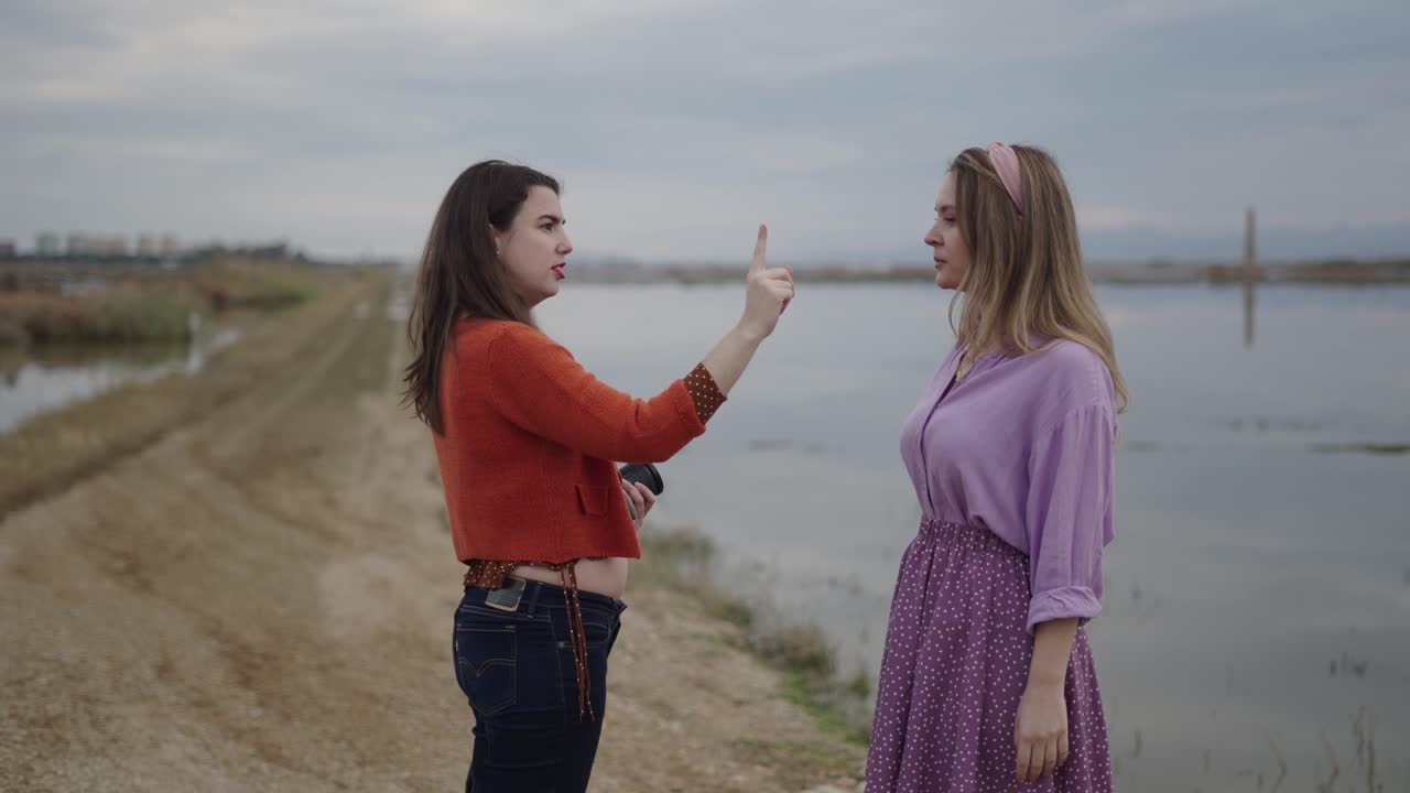 Women Arguing by a Lake