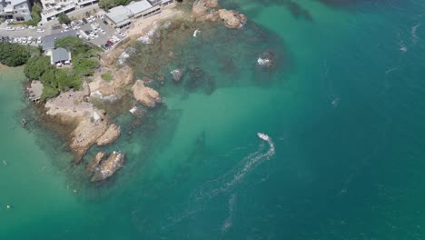 Vertical-aerial-shows-the-clear-green-water-of-lagoon-at-Knysna-Heads