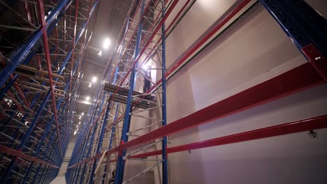 big and modern warehouse under construction, featuring metal shelving and other industrial equipment.