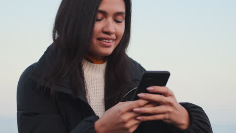 asian girl using mobile phone.