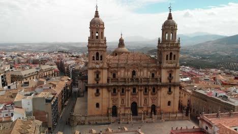 Spain-Jaen-Cathedral,-Catedral-de-Jaen,-flying-shoots-of-this-old-church-with-a-drone-at-4k-24fps-using-a-ND-filter-also-it-can-be-seen-the-old-town-of-Jaen