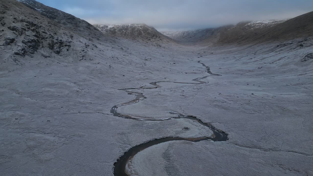 Glen Kingie Scotland mountains with frost and snow in winter aerial