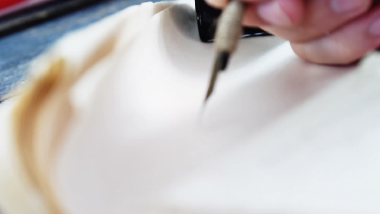 Hand of person writing on constitution document