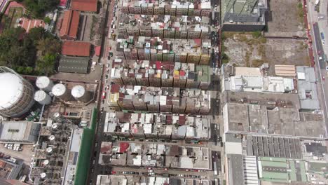 hong kong kowloon walled city, a densely populated slum, aerial view