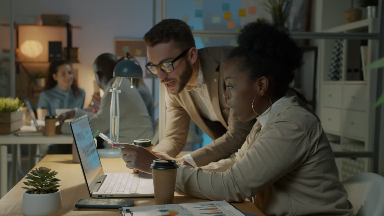 Business Collaboration in the Office at Night