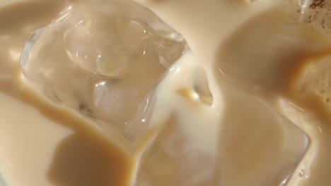 close-up of ice cubes in creamy beige drink