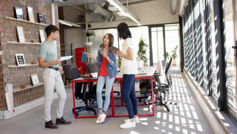 discussing interior design project, multiracial colleagues collaborating in modern office space