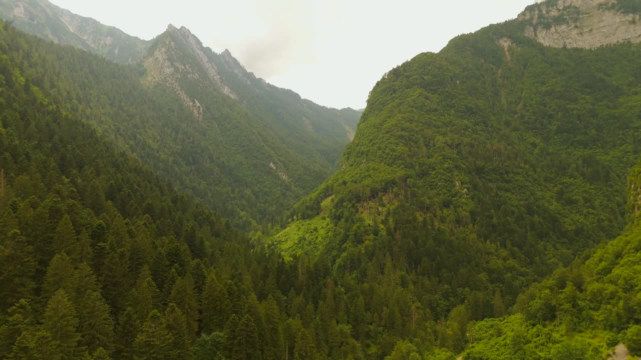 This drone shot reveals the serene beauty of a mountain town.