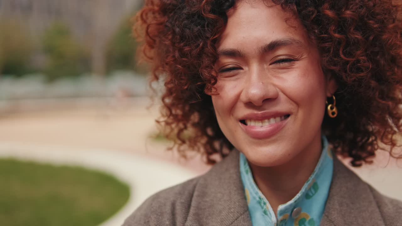 Portrait of a Happy Young Woman in The City