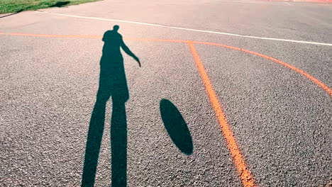 basketball player dribbling slow motion shadow