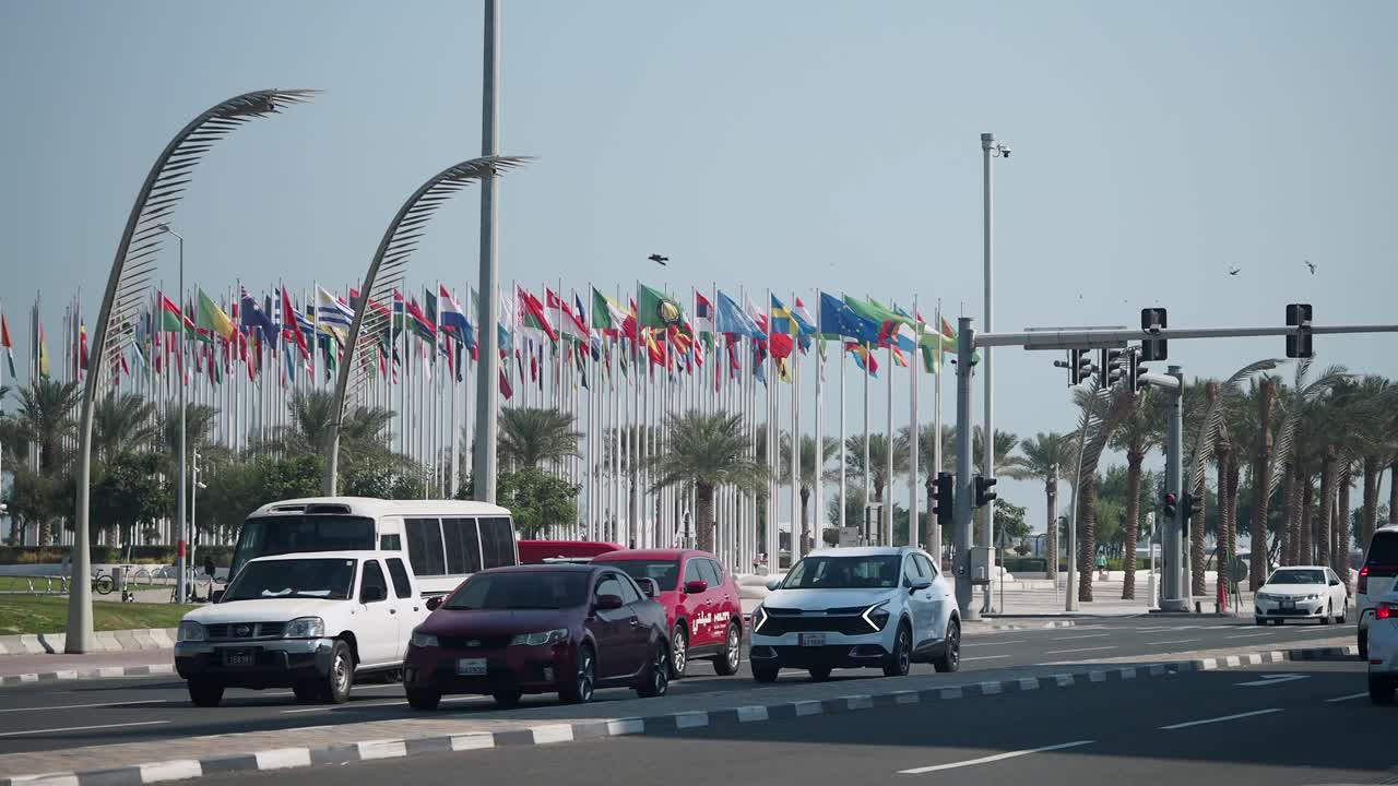 City Street Traffic with International Flags and Palm Trees