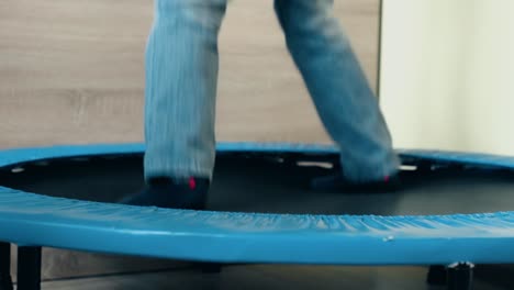 child jumping on trampoline