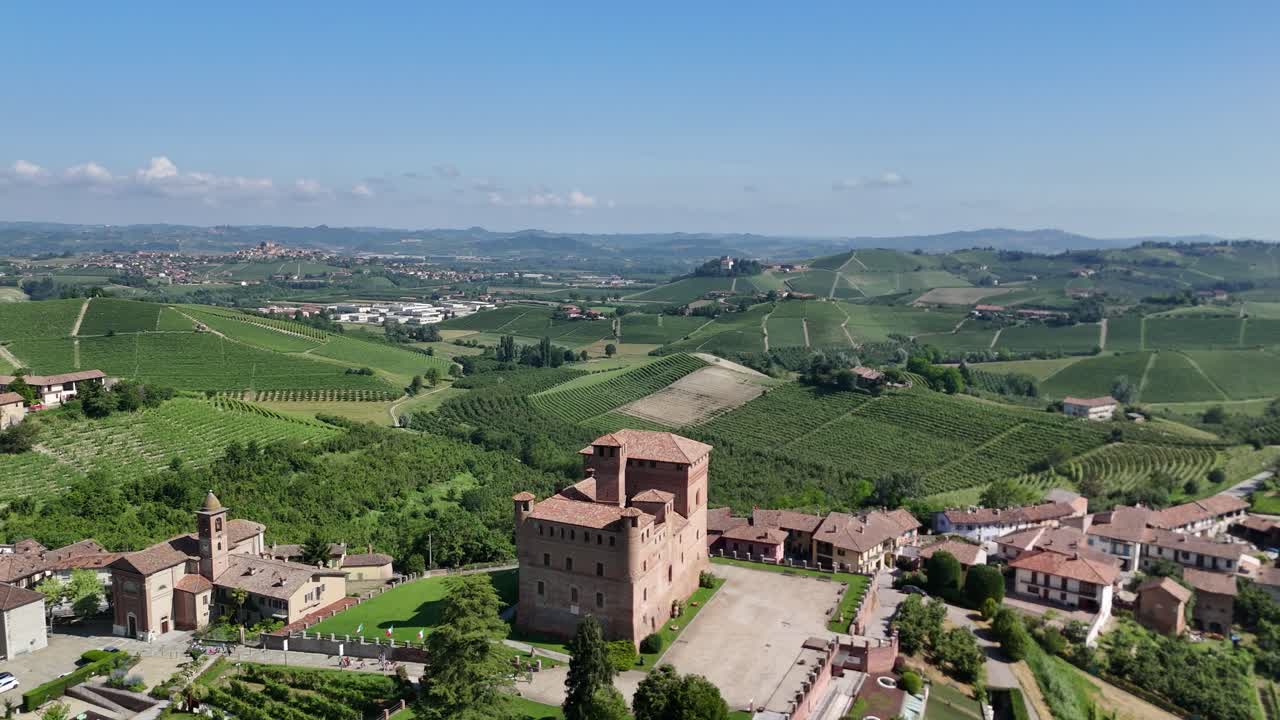 Grinzane Cavour castle, UNESCO site, Cuneo, Piedmont, Italy. 4k aerial view of the castle together with the Vineyard. Langhe-Roero and Monferrato. Circling to the left panoramic view.
