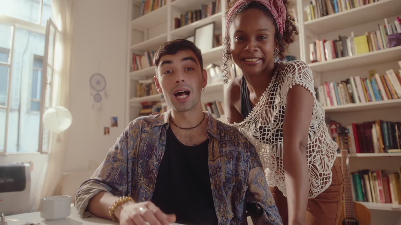 Young Couple Vlogging or Chatting on Video Call at Home