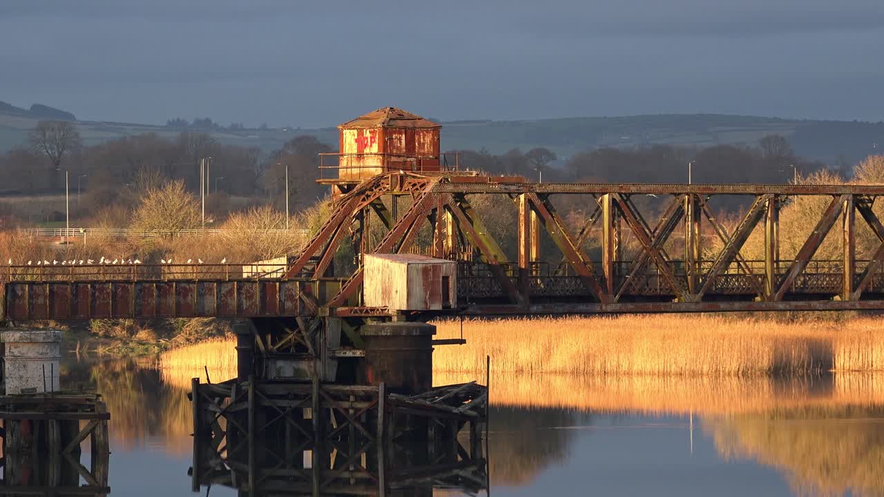 Waterford The Red Iron Bridge disused railway bridge near Waterford on a cold winter afternoon at golden hour