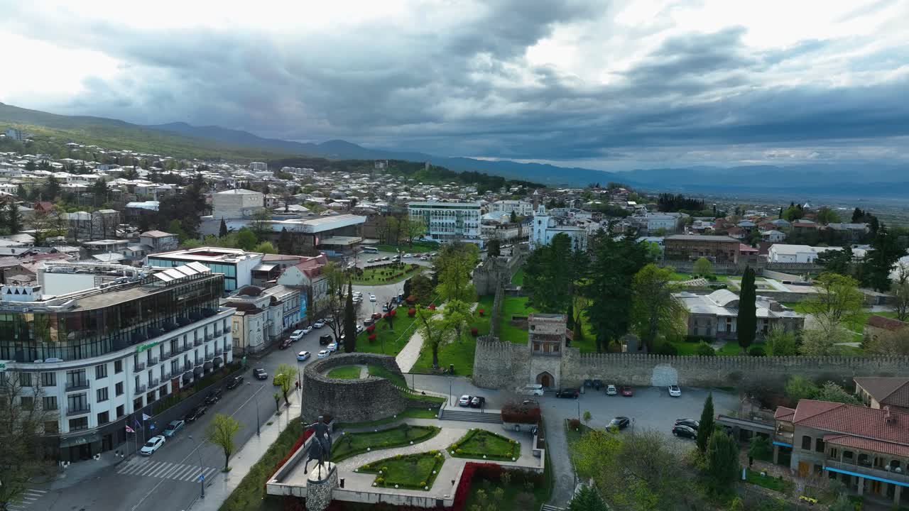 Aerial view of a historic Georgian city center with fortress walls, streets, and surrounding urban landscape
