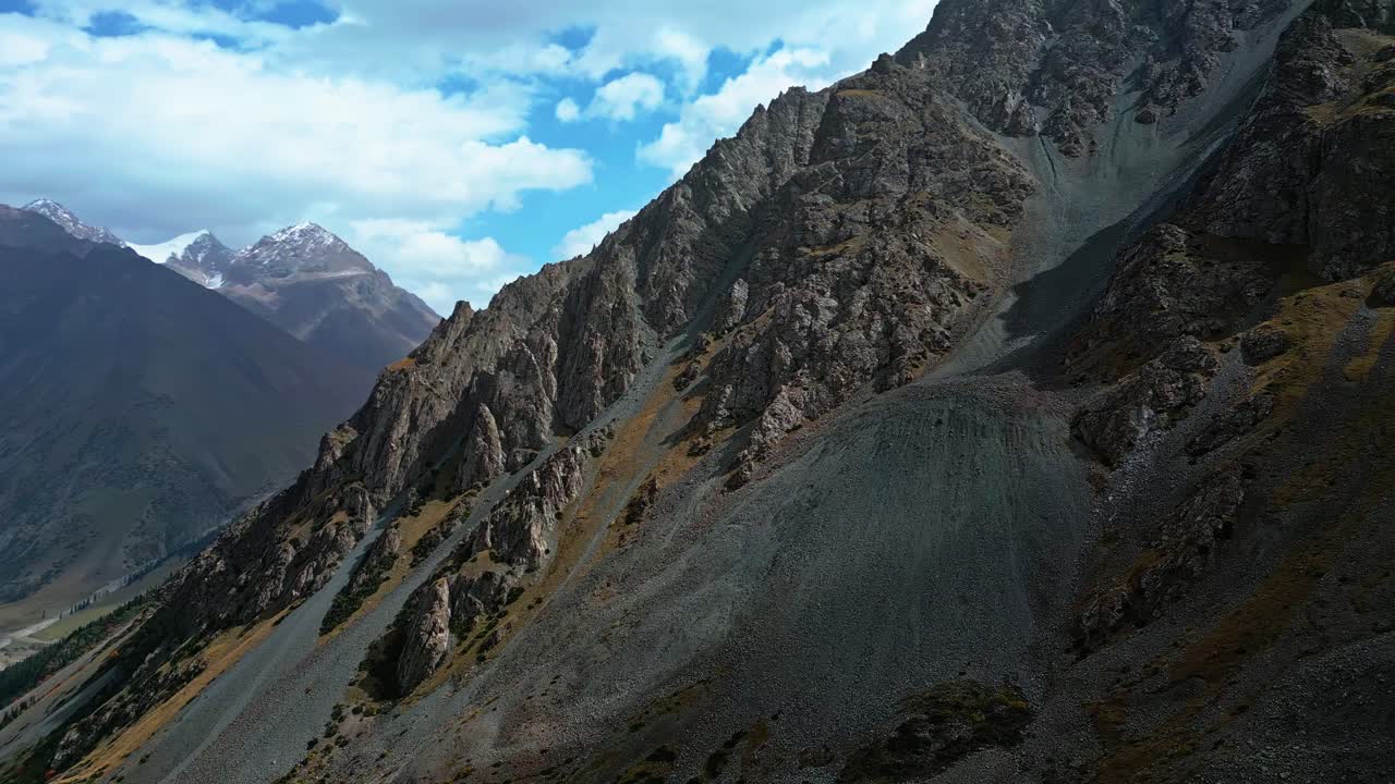 Remote peaks, harsh terrain, mountain pass, barren Kyrgyzstan, aerial
