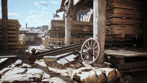 rustic wooden structures and wagon wheel in a sunny old town setting