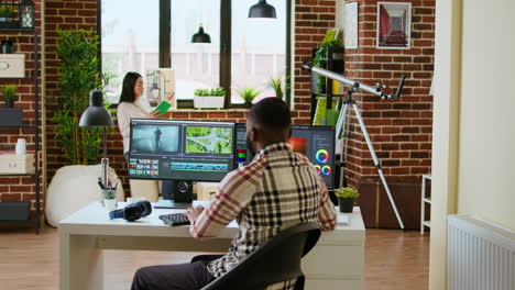 African-american-freelancer-editing-a-background-video-at-his-home-office