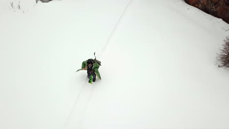 person walking on snowy path