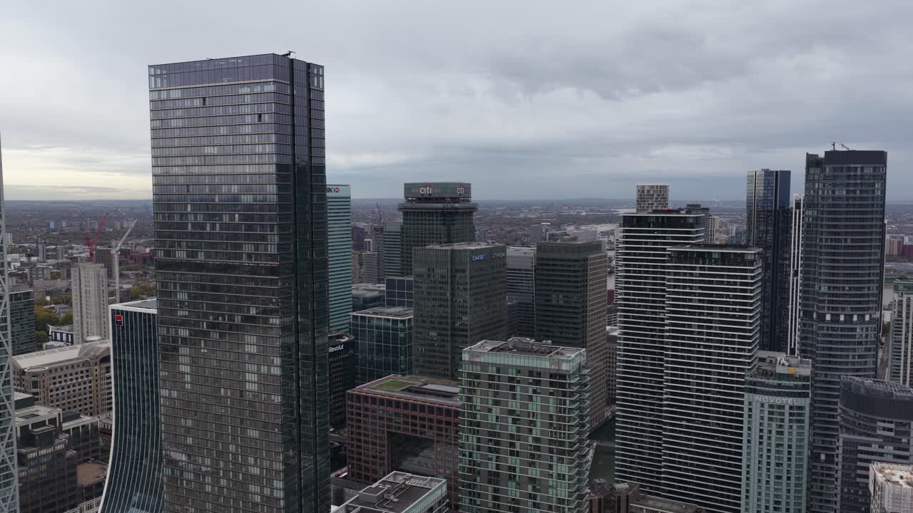 Aerial drone view of Canary Wharf in London, showcasing its modern skyscrapers, multinational headquarters, financial institutions, and the iconic skyline of one of Europe’s major business districts