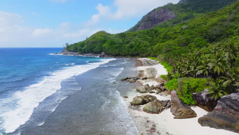 Aerial-drone-view-of-rocky-coastline-on-Silhouette-Island-in-the-Seychelles,-Indian-Ocean