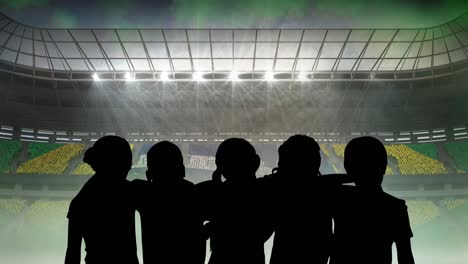 animation of silhouettes of team of sports women with brazilian flag over sports stadium