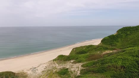 Green-Hills-and-Endless-Ocean-Landscape