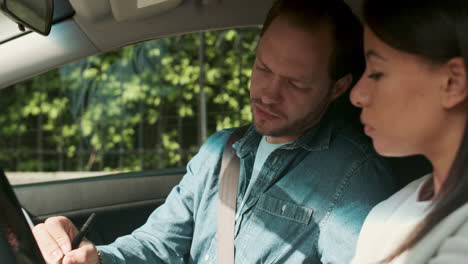 woman and teacher in driving school