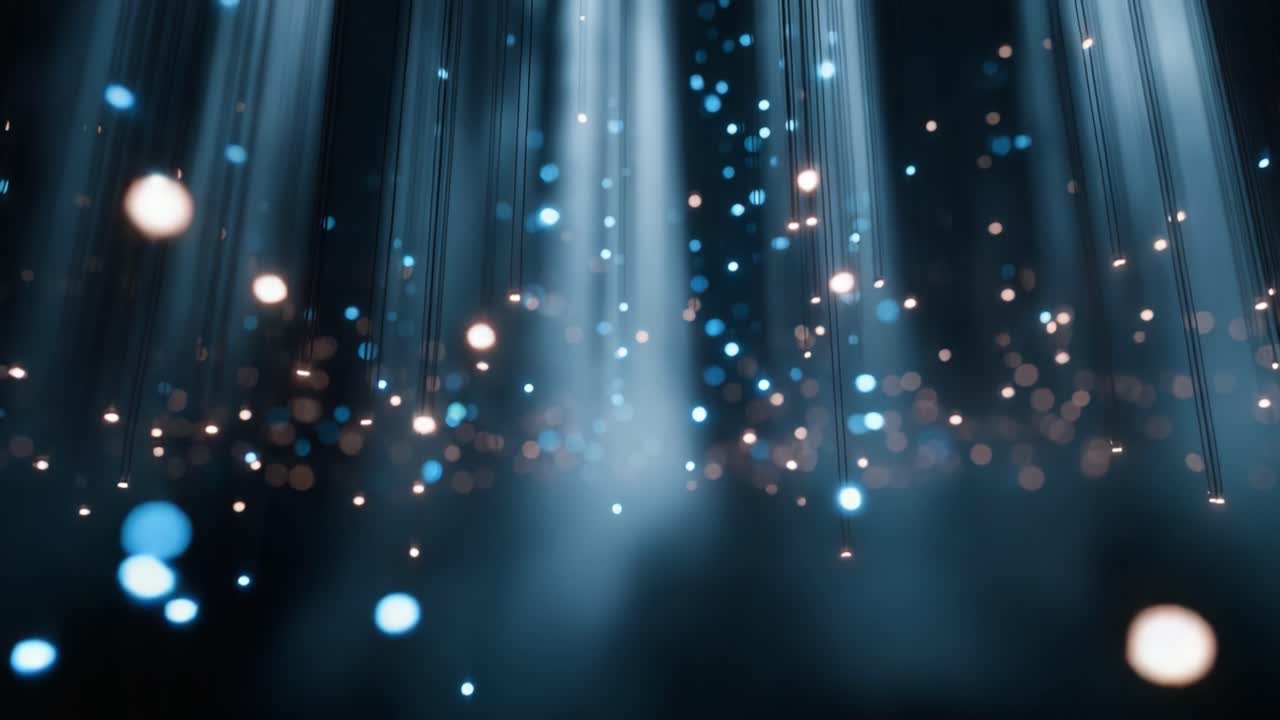 Un affascinante contenuto visivo di luci a cascata crea un'atmosfera coinvolgente, con particelle blu e bianche luccicanti che illuminano delicatamente lo sfondo scuro.