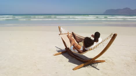 couple interacting with each other while lying in a hammock 4k