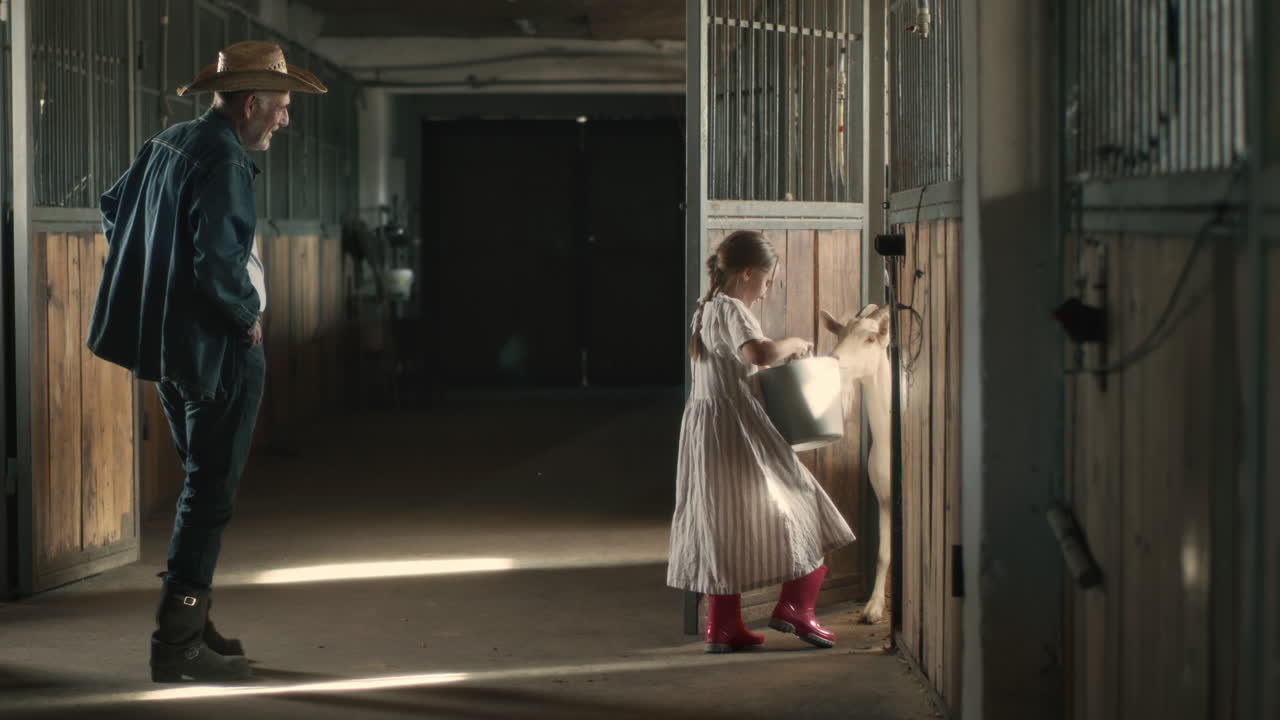 Grandparent and Grandchild Feeding Horses in a Stable