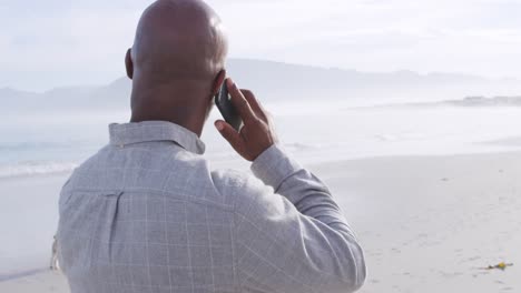 mature man enjoying time outside by the sea